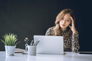 Confused business woman with stressed and worried about  working mistake and problems.