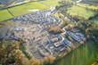 Large housing development aerial view in construction on rural countryside site Scotland UK