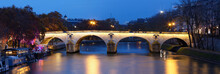 The Panoramic View Of Bridge Ponte Marie Over Seina River At Night , Paris, Europe.