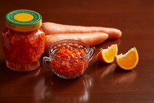 Carrot Jam In A Jar And Bowl, Carrots, Mandarin Slices For Decoration.