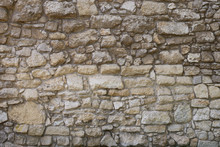 Photo Of Old Brown And Gray Stone Wall Texture. Stone Wall For Background Or Texture.