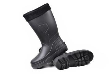 black high insulated specialized boots for hunting off-road fishing and traveling in the cold season on a white background isolate