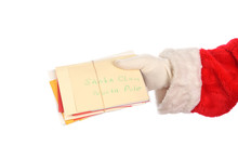 Santa Claus Holding A Bunch Of Christmas Letters From Children. Hand Only Isolated On White.