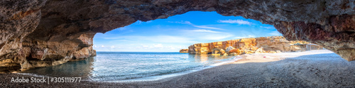 Beach of Spilies or Kitrenosi with sea caves near Rethimno, Crete, Greece.