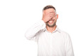 © Igor - smiling businessman covering eyes with hand isolated on white