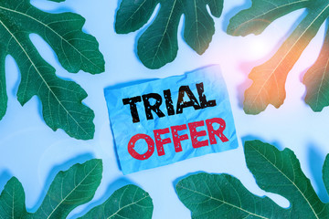 Aufkleber - Conceptual hand writing showing Trial Offer. Concept meaning A temporary free or discounted offer of a product or services Leaves surrounding notepaper above empty soft pastel table