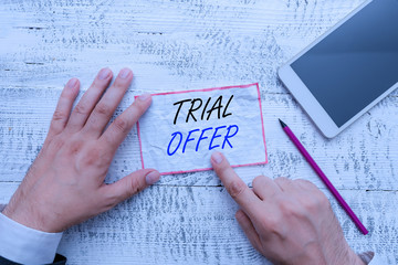 Aufkleber - Writing note showing Trial Offer. Business concept for A temporary free or discounted offer of a product or services Hand hold note paper near writing equipment and smartphone