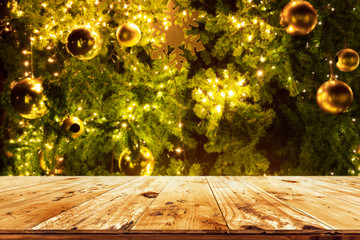 Wall Mural - beautiful christmas tree backdrop and lights with top of empty wood table. ready for your product di