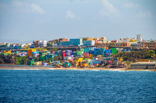 Colorful Houses Line The Hill Side Overlooking The Beach In San Juan, Puerto Rico.
