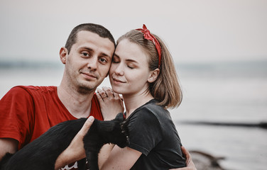 Loving couple on the lake at the beach. Guy and girl love