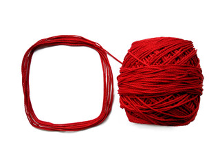 Red knitting yarn for handicrafts isolated on white background. Background of wool yarn, knitted yarn, can also be used as a yarn frame.