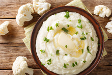 Homemade Mashed Cauliflower With Butter And Parsley Close-up On A Plate. Horizontal Top View