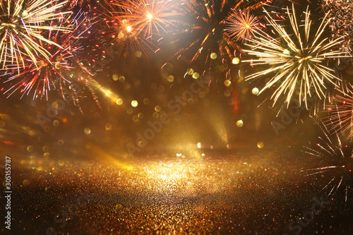Cuadros en Lienzo abstract gold, black and gold glitter background with fireworks