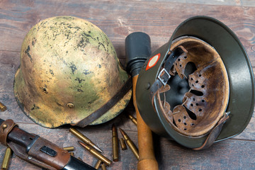 ww2 german army field equipment with helmets and grenade