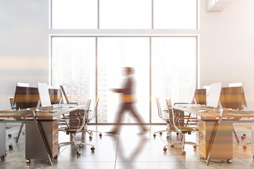 Wall Mural - Blurry businessman walking in white office