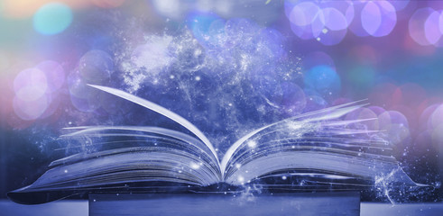 Poster - The blurred book that is bewitched with magic, the magic light in the dark, with the bright light shining down as the power to search for knowledge. For research and use as a blurred background