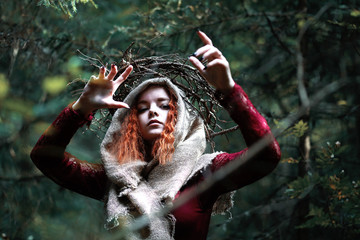 Wall Mural - The red-haired witch holds a ritual with a crystal ball