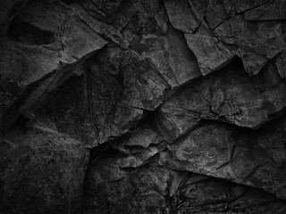 dark stone background. black white rock granite texture. mountain surfase close-up.