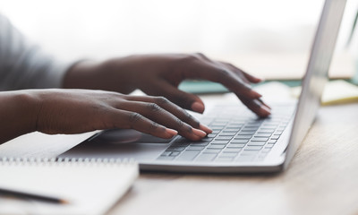 Poster - Black woman typing on laptop keyboard while working in office