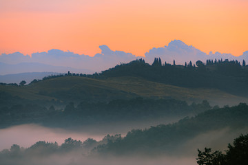 Beautiful Tuscany scenery with rolling hills at sunrise