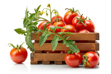 Harvest Tomatoes In Wooden Box With Green Leaves And Flowers. Vegetable Still-life Isolated On White Background.