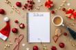 © juliasudnitskaya - Cup of coffee, holiday decorations and notebook with to do list on golden background top view, Christmas planning concept. Flat lay style.