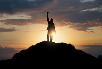 silhouette of man standing on the hill,business, success,victory,leadership,achievement concept.