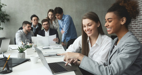 Aufkleber - Multiethnic coworkers discussing new project, working on laptop
