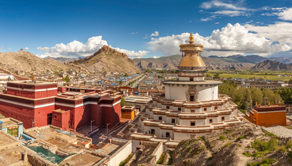 Panoramic view of Kumbum Stupa in Gyantse with Dzong fortress in background, Tibet