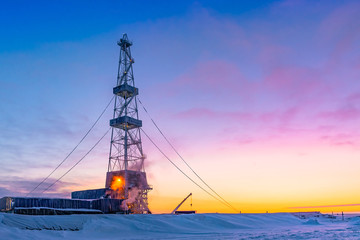 Wall Mural - Winter polar day in the arctic. Drilling a well at a northern oil and gas field. Low sun. Beautiful lighting.