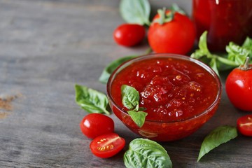 Sticker - tomato jam or marmalade with basil. unusual jam. Turkish, French or Italian cuisine. copy space