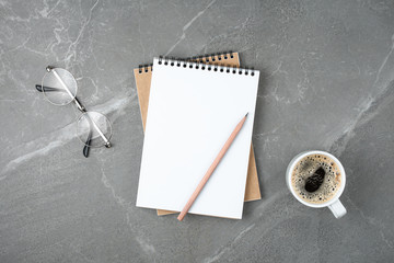 notebook with coffee on table