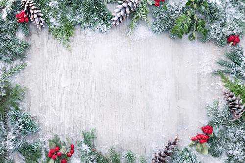 Cuadros en Lienzo Christmas and New Year background with fir branches and snowfall on wooden white
