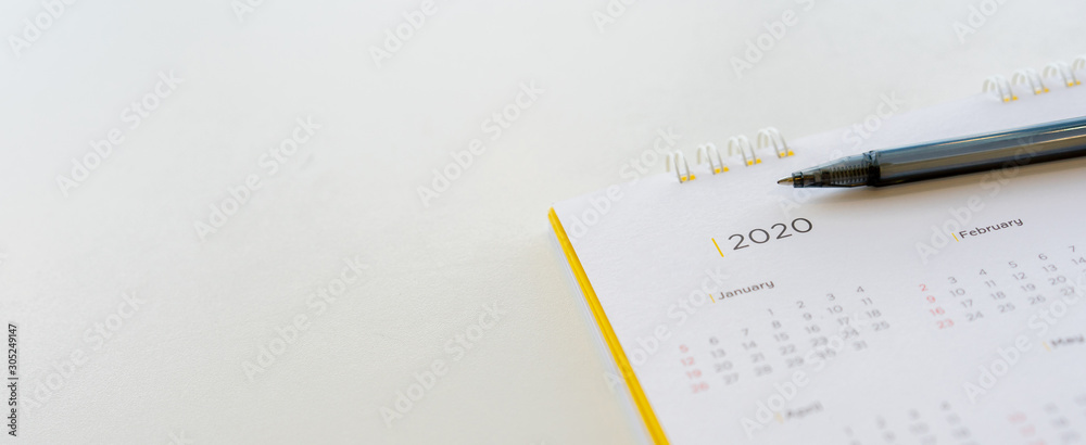 close up side view on  white calendar schedule background with pen to make appointment meeting or manage timetable each day for planning work in new year 2020 resolution concept - obrazy, fototapety, plakaty 