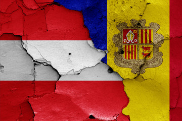 flags of Austria and Andorra painted on cracked wall