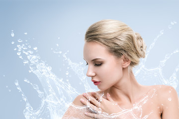 Young beautiful woman portrait with water splash