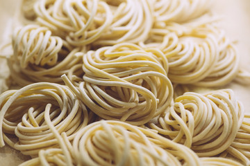 Pasta fresh (italian spaghetti) in classic style on white background. Homemade cooking