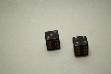 black dice on a light background