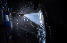 Car Wash, Capturing The Water Sprayed At The Wheels 
