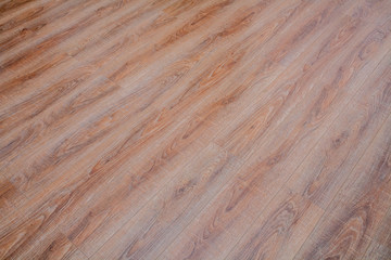 Sticker - The floor of the light brown laminate diagonally