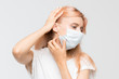 © Denis Mamin - Close up studio portrait of woman in white t-shirt with medical mask who scratching itchy throat. Irritation, sensitive dry skin, allergy symptoms, dermatitis, insect bites. Healthcare concept.