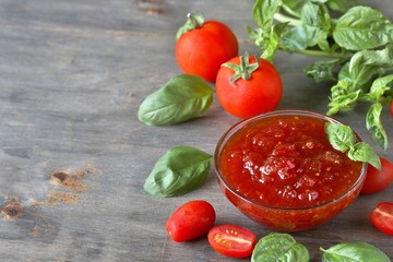 Sticker - tomato jam. Jam from tomatoes with basil. Soft focus. Place for text. Copy Space.