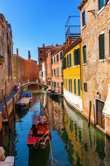 Gondola in canal of Venice