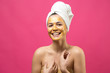 © Mountains Hunter - Beauty portrait of woman in white towel on head with gold nourishing mask on face. Skincare cleansing eco organic cosmetic spa relax concept.