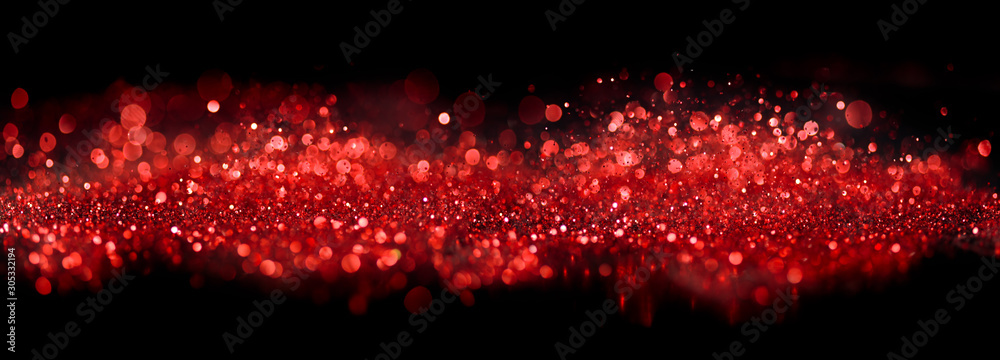 Bokeh of sparkling red lights and glitter on black - obrazy, fototapety, plakaty 