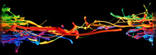 Abstract Paint And Ink In A Rainbow Of Colors Splashing Into The Air, Frozen Motion In A Creative And Unique Shape.