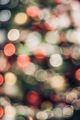 Leinwandbilder - Abstract color blur decoration ball and light string on christmas tree with bokeh light background.winter holiday seasonal
