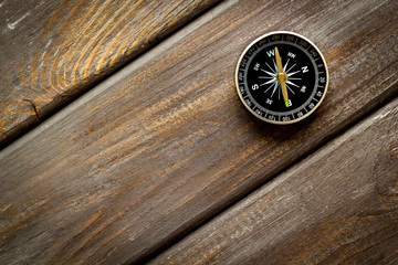 Wall Mural - Compass - small and stylish - on dark wooden background top view copy space