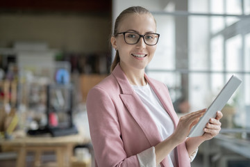 Canvas Print - Successful businesswoman using digital tablet while preparing presentation