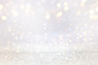 © tomertu - abstract background of glitter vintage lights . silver, gold and white. de-focused